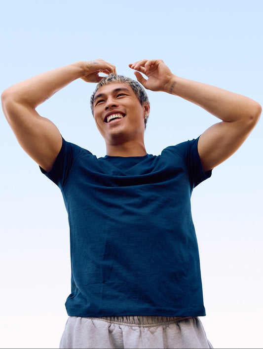 man wearing merino shirt smiling